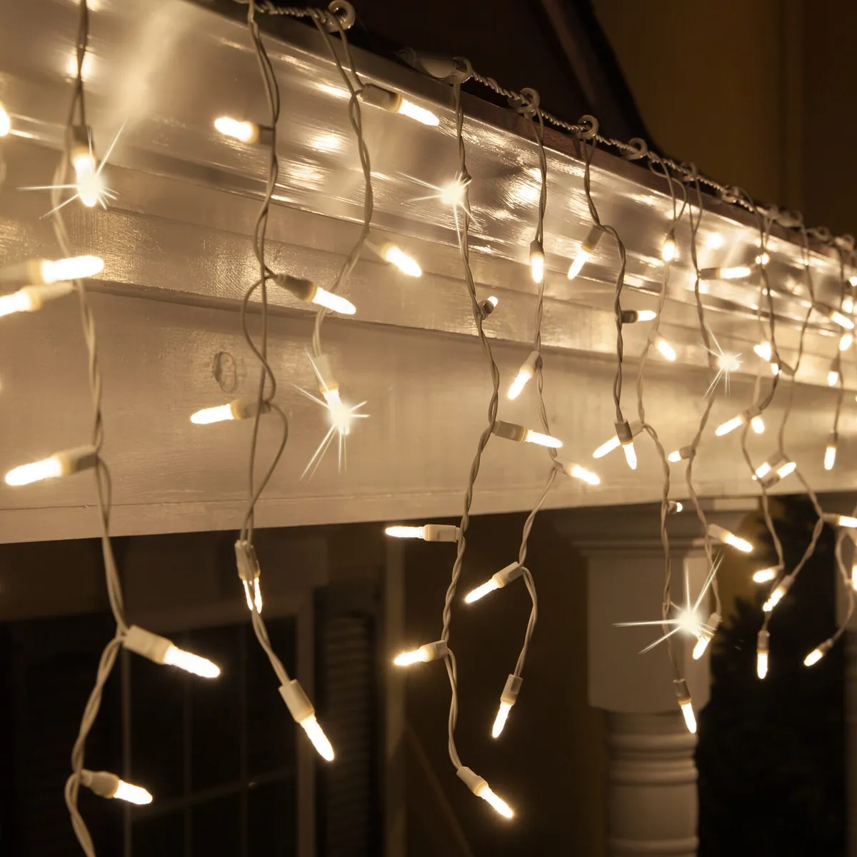 Warm White M5 LED Twinkle Icicle Lights on White Wire - Wintergreen Lighting® 85437