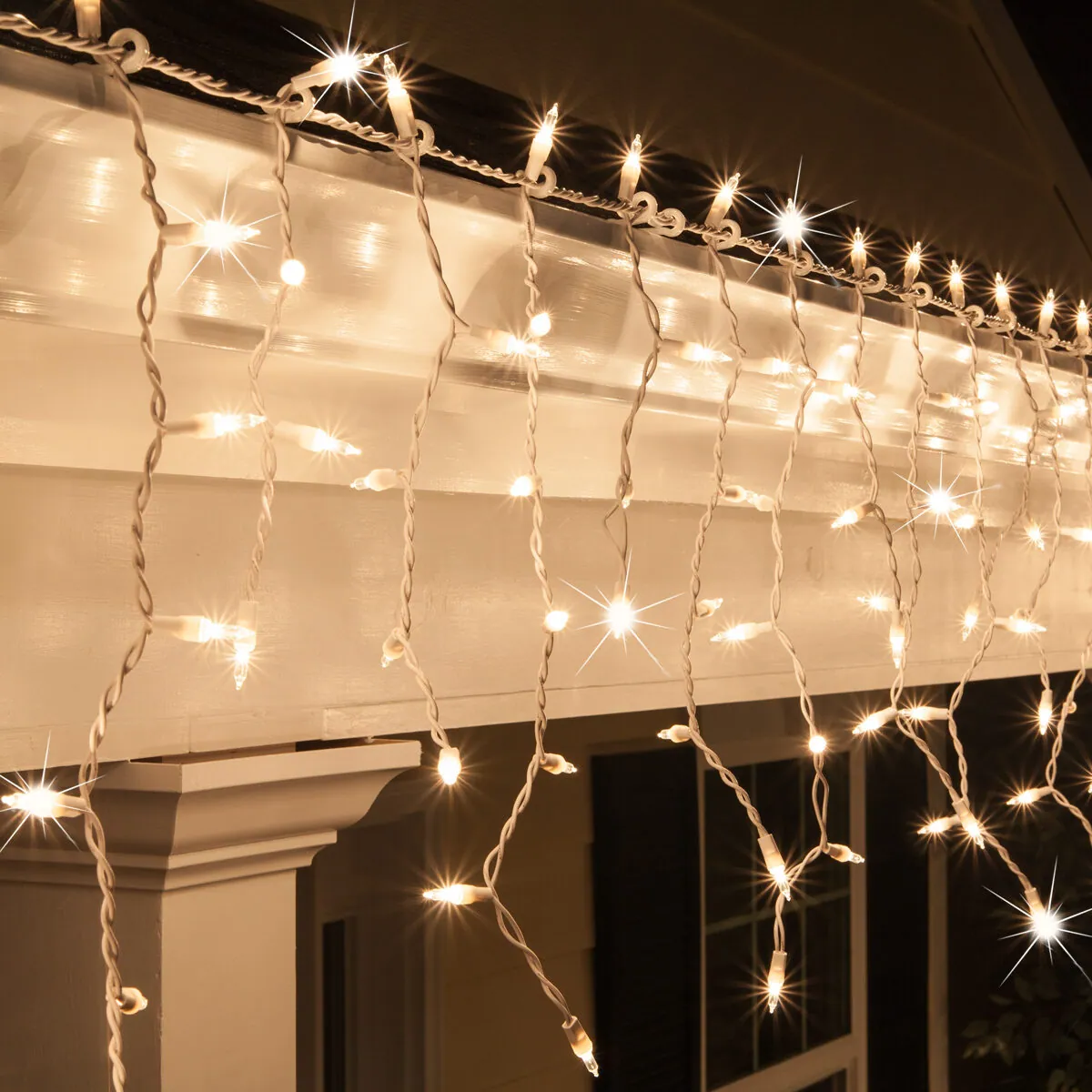 Clear Mini Twinkle Icicle Lights on White Wire - Kringle Traditions® 15243