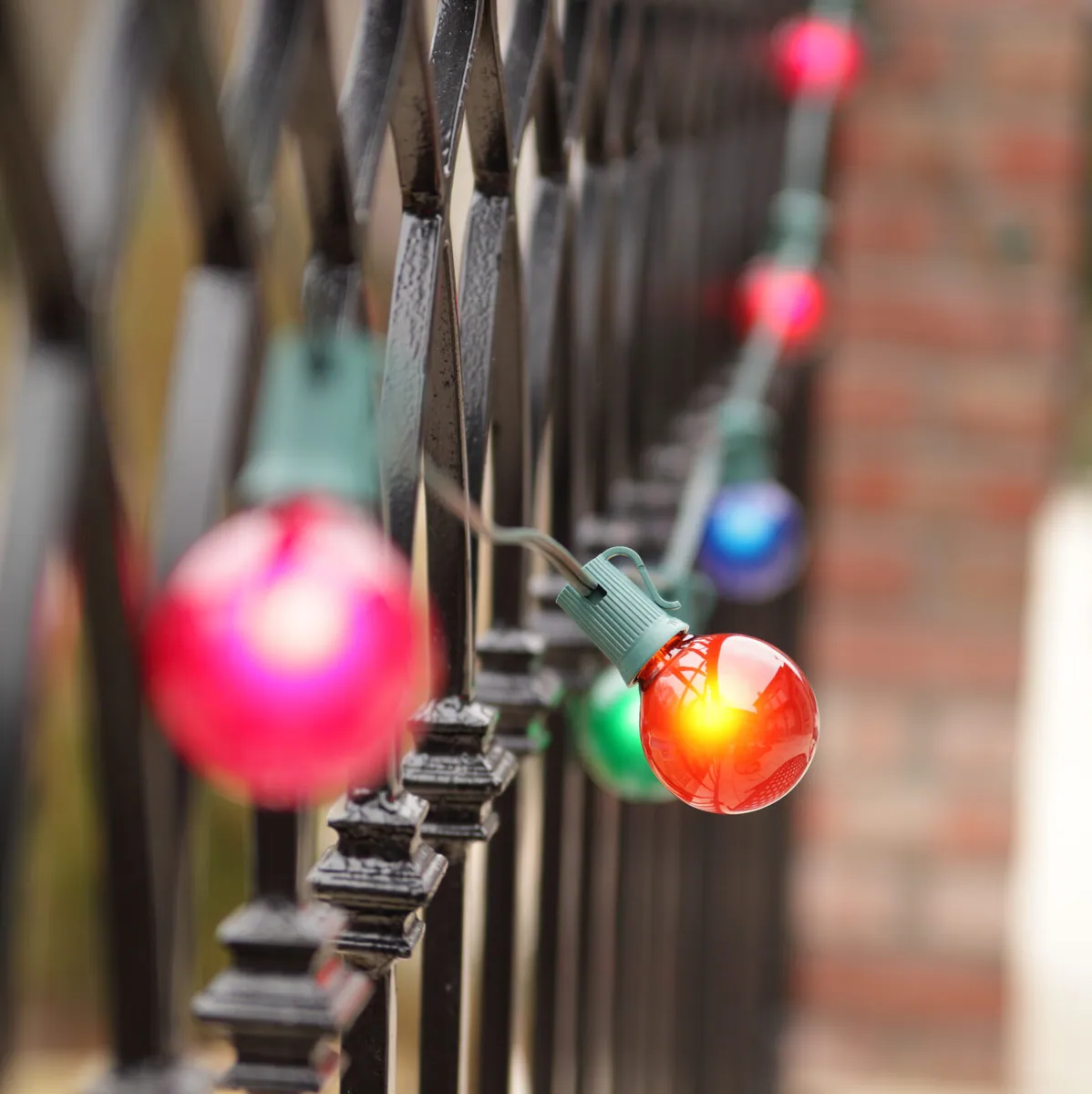 Commercial Multicolor Satin Patio String Light Set with G50 E17 Bulbs on Green Wire — 33 Lights, 50 Feet - Wintergreen Lighting® 69464